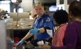 Obama signs bill to boost airport security after TSA shooting