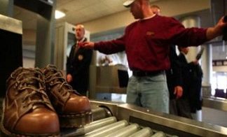 Flyers made to remove shoes, belts at airports
