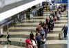 American Airlines hires private security to help manage queues