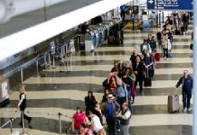 American Airlines hires private security to help manage queues