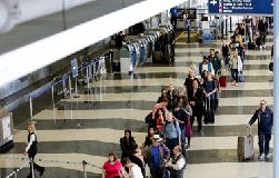 American Airlines hires private security to help manage queues