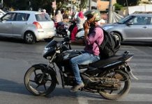 Taking calls while driving not against law, rules Kerala High Court