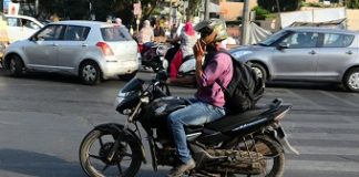 Taking calls while driving not against law, rules Kerala High Court