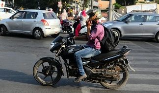 Taking calls while driving not against law, rules Kerala High Court